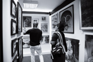 Visitors at the opening day of Chuck Gallery's Summer Exhibition, Seeing in Black and White